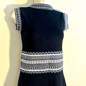 Mini A line sweater dress. Sleeveless with high neckline (not turtleneck).